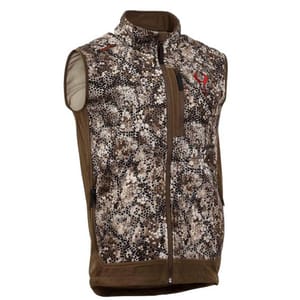 A camouflage-patterned vest with a high collar and brown side panels, featuring a front zipper and multiple zippered pockets, including a chest pocket. It has a small red logo on the upper chest.