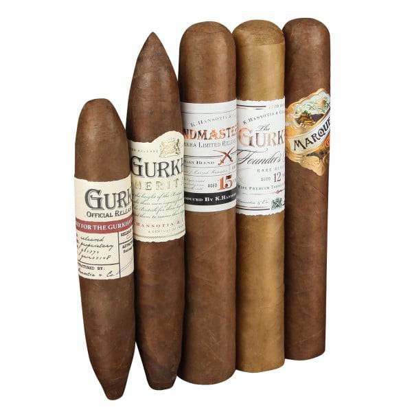 A collection of five Gurkha cigars with various labels and packaging, showcasing different blends and editions.