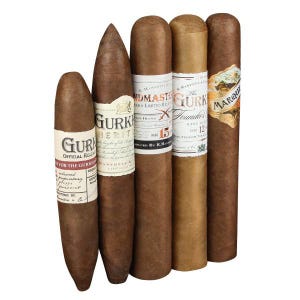 A collection of five Gurkha cigars with various labels and packaging, showcasing different blends and editions.