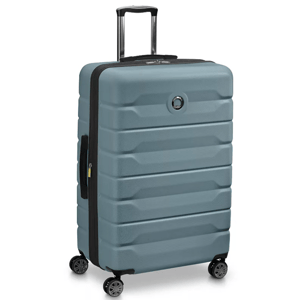 A large, hard-shell suitcase with a textured blue design, featuring a retractable handle, four spinner wheels, and a circular logo on the front.