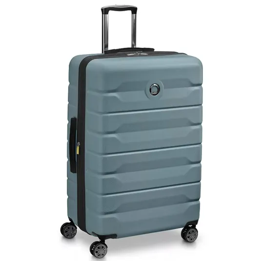 A large, hard-shell suitcase with a textured blue design, featuring a retractable handle, four spinner wheels, and a circular logo on the front.