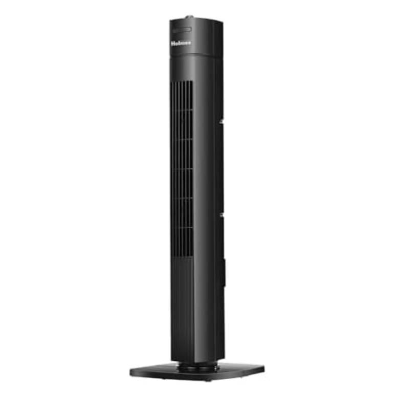 A black Holmes tower fan with a slim, vertical design on a square base, featuring an air vent running along the front for even airflow distribution.