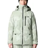 A light green and white camouflage-patterned jacket with a hood, featuring the \“Mountain Hardwear\“ logo, worn by a person with a black beanie.