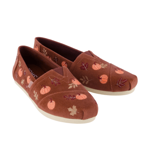 Brown slip-on shoes with a fall theme, featuring embroidered pumpkins and leaves.