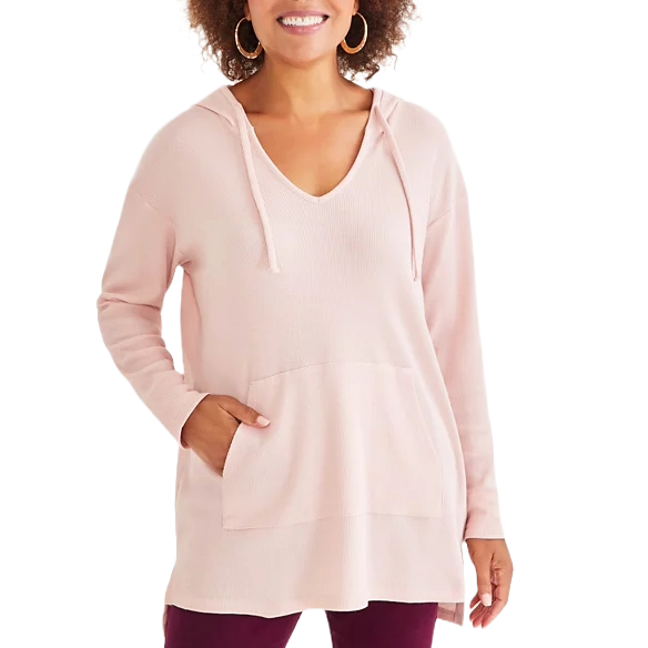 A light pink, waffle-knit tunic hoodie with a V-neck, long sleeves, a front kangaroo pocket, and a relaxed fit.