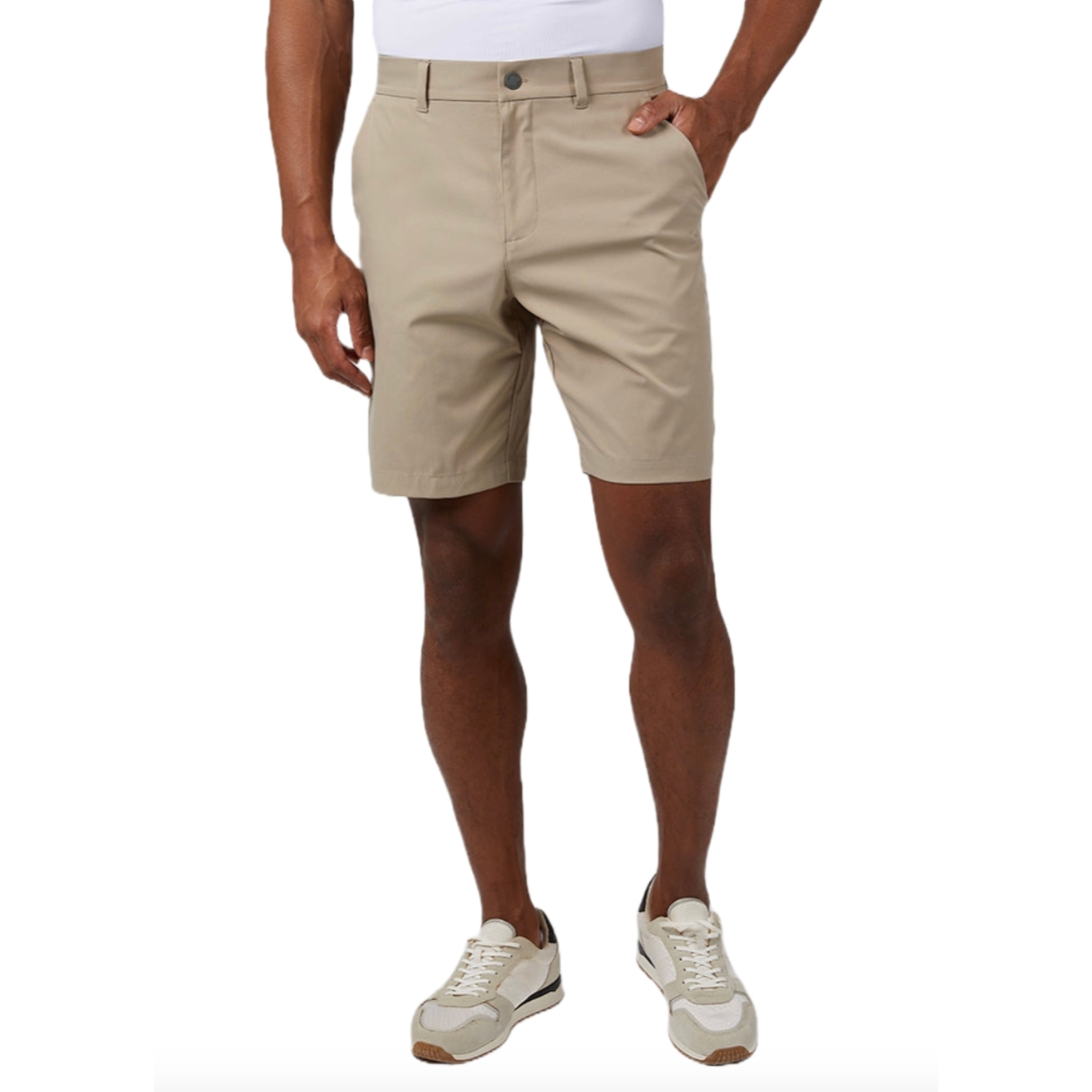 32 Degrees Woven Classic Shorts are light beige, knee-length shorts featuring a button closure, belt loops, and side pockets, paired with white sneakers.