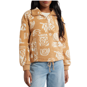 Tan fleece pullover with a half-zip and abstract white patterns, featuring elastic cuffs and a drawstring hem, paired with light blue jeans.