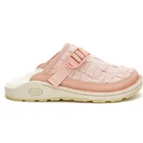 A pink slip-on clog featuring a fur-lined interior, adjustable strap, and a durable sole, branded with \“Chaco\“ on the side.