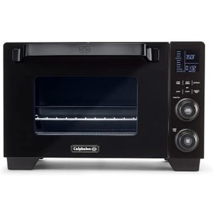 Calphalon countertop convection oven with digital display, temperature/time controls, and multiple cook functions.