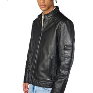A black leather jacket with a front zipper, side pockets, and a zippered pocket on the upper arm, paired with light blue jeans.