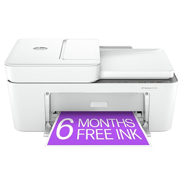 A white HP DeskJet 2652 All-in-One Inkjet Printer is shown with an output tray extended, printing a purple page that reads \“6 MONTHS FREE INK.\“