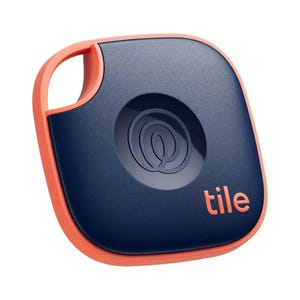 The 2024 Tile Mate Bluetooth Tracker is a compact, square device with a navy-blue body and orange trim, featuring a keyhole for attachment. It's designed to help locate lost items via a smartphone app.