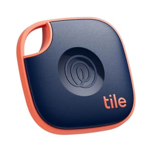 The 2024 Tile Mate Bluetooth Tracker is a compact, square device with a navy-blue body and orange trim, featuring a keyhole for attachment. It's designed to help locate lost items via a smartphone app.