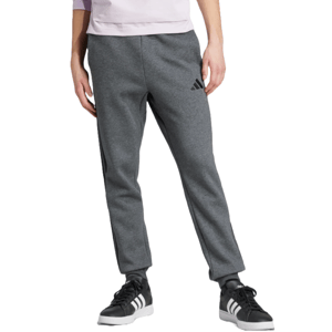Gray Adidas fleece pants with a subtle logo on the upper leg, featuring a relaxed fit and ribbed cuffs. Paired with black and white Adidas sneakers.