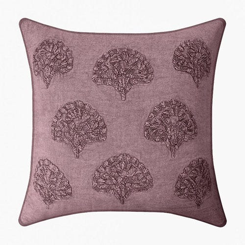 Square decorative pillow with a plum-colored background featuring an embroidered tree pattern.