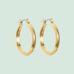Pair of gold hoop earrings with a smooth, polished finish.