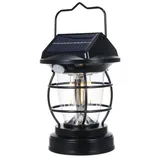A black solar-powered lantern with a handle, featuring a cage design around the glass enclosure and a motion sensor beneath the solar panel on top.