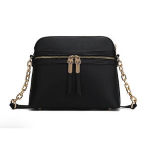 A black crossbody bag with a gold chain strap and gold zipper.