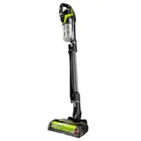 A cordless stick vacuum cleaner with a detachable canister, featuring a sleek design and green accents.