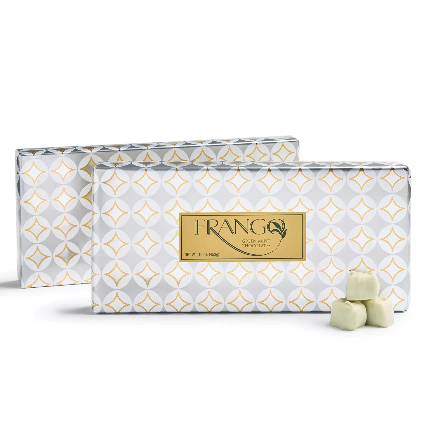 Frango Green Mint Chocolates, packaged in sleek white and gold patterned boxes, shown with a few green mint chocolate pieces in front. Each box weighs 16 oz (453g).