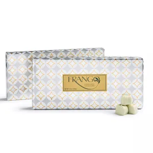 Frango Green Mint Chocolates, packaged in sleek white and gold patterned boxes, shown with a few green mint chocolate pieces in front. Each box weighs 16 oz (453g).