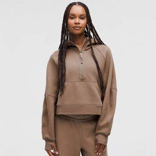 a person wearing a brown hoodie with matching brown pants