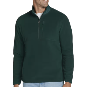 A man is wearing a dark green, quarter-zip fleece pullover with a high collar. It features a chest pocket with a zip and is paired with light blue jeans.