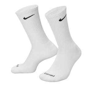White athletic crew socks with a black Nike logo and \“DRI-FIT\“ text on the toe area.