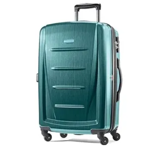 Teal hard-shell suitcase with a telescopic handle and four spinner wheels for easy mobility.