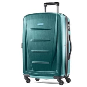 Teal hard-shell suitcase with a telescopic handle and four spinner wheels for easy mobility.