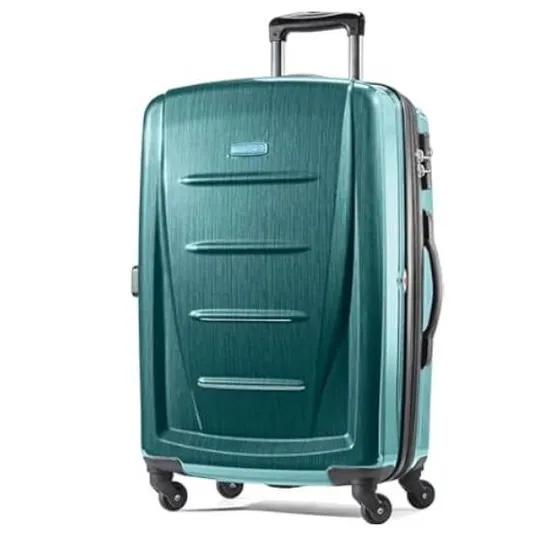 Teal hard-shell suitcase with a telescopic handle and four spinner wheels for easy mobility.