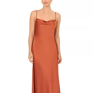 A sleeveless, cowl-neck slip dress in a rust color with thin straps and a fitted silhouette.