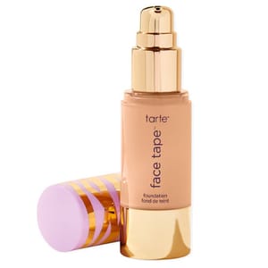 Tarte Face Tape Foundation with a pump dispenser and a decorative cap featuring a striped design.