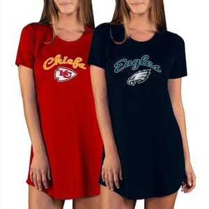 Two women wear nightshirts featuring NFL team logos: one red with the Kansas City Chiefs logo and one black with the Philadelphia Eagles logo.