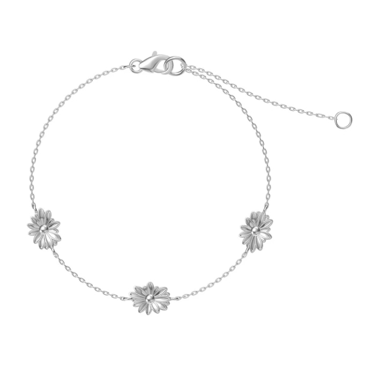 This is a silver bracelet featuring three evenly spaced daisy-like flowers connected by a thin chain with an adjustable clasp.