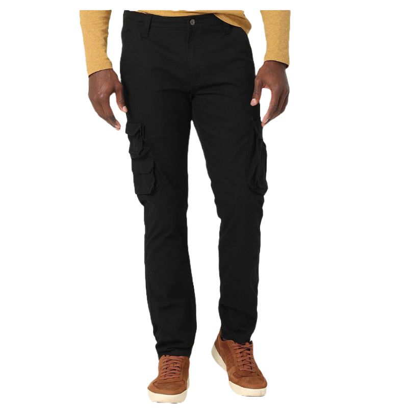 Black tapered cargo pants with multiple pockets and a button closure, paired with a yellow shirt and brown sneakers.