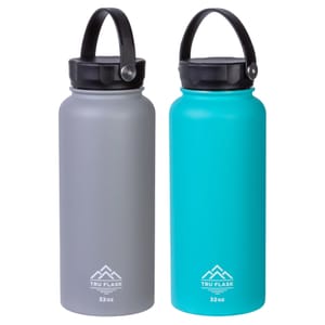 Two insulated water bottles by Tru Flask, each with a 32oz capacity. One is gray, and the other is teal, both featuring black caps with carrying handles.