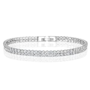 Silver tennis bracelet featuring a row of sparkly round gemstones, secured with a clasp.