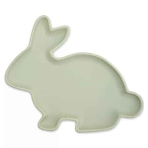 A pale green serving platter shaped like an Easter bunny, featuring a simple silhouette with ears and tail outlined clearly.