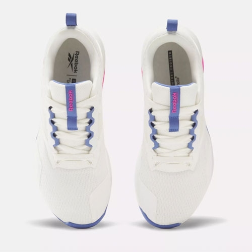 a pair of white reebok nanoflex sneakers with purple accents