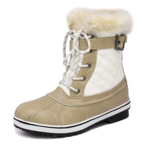 Beige mid-calf snow boots with white quilted panels, a fluffy faux fur cuff, lace-up front, and a side buckle detail, set on a black and white sole with treads.