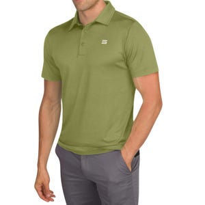 A man wears a short-sleeve, olive green Three Sixty Six Golf Polo with a small white logo on the chest, paired with gray pants.