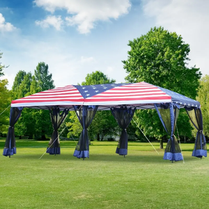 10' x 20' party tent with an American flag design canopy, featuring dark mesh curtains and anchoring ropes, set on a grassy lawn surrounded by trees.