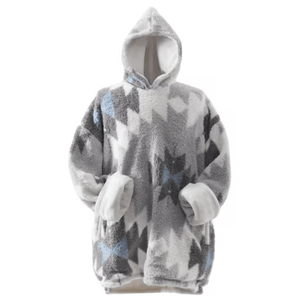 A cozy, oversized hooded blanket sweatshirt with a geometric pattern in shades of gray, white, and blue. It features large sleeves and a soft, plush lining.