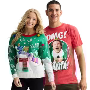 A woman wears a festive llama-themed sweater, while a man sports a red T-shirt featuring a humorous \“OMG! SANTA!\“ design with a character from a Christmas movie.