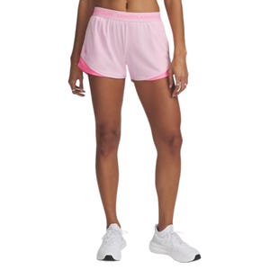 Pink Under Armour athletic shorts with an elastic waistband and white sneakers.