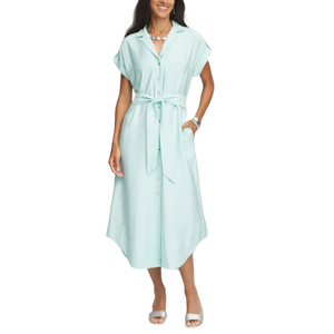 Light turquoise midi shirtdress with short sleeves, button-down front, spread collar, and waist tie. The dress has a casual fit and side pockets, paired with silver sandals and accessories.