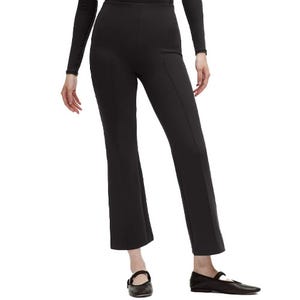 Black cropped flare pants and black ballet flats, paired with a long-sleeve top.