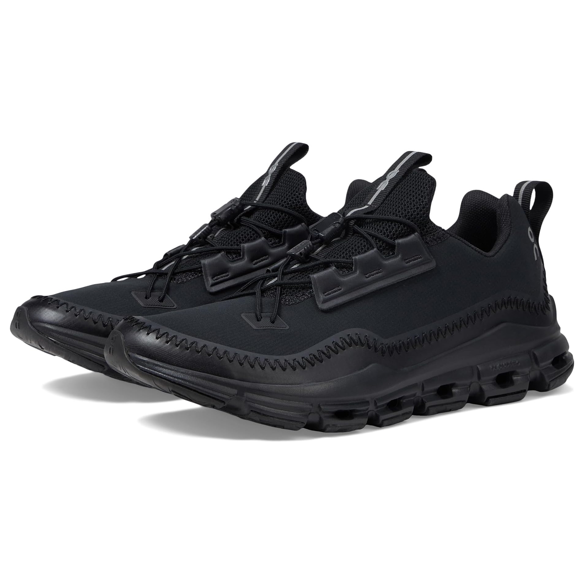 A pair of black athletic sneakers with a chunky sole and lace-up front.