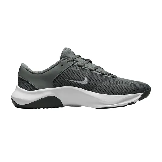 A gray and black athletic shoe with a white sole and a small swoosh logo on the side.